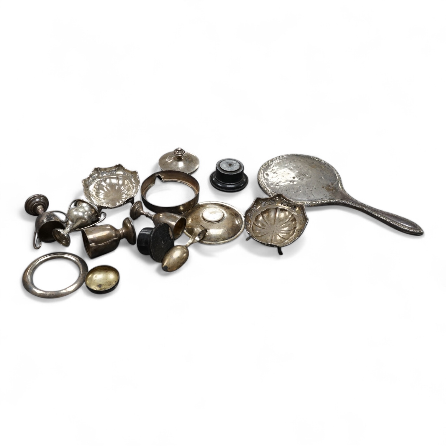 A small group of sundry silver including a mounted hand mirror, small trophy cups, dishes, etc.